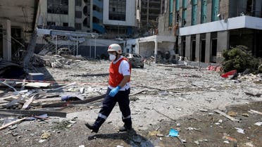 A Lebanese Red Cross member walks among the debris from damaged buildings following Tuesday's blast in Beirut's port area, Lebanon August 5, 2020. (Reuters)