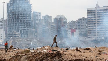 A soldier walks at the devastated site of the explosion in the port of Beirut, Lebanon, Aug.6, 2020. (AP)