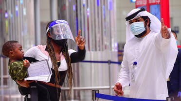 A tourist receives instruction at Dubai airport in the United Arab Emirates on July 8, 2020. (AFP)