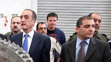 Former Lebanese Customs chief Shafik Merhi (C) and current Customs chief Badri Daher (R) are seen in this picture at the Port of Beirut, May 17, 2010. (File Photo: AP)
