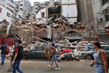 Lebanese volunteers clear the rubble at the devastated Gemmayzeh neighbourhood, on August 7, 2020, in the aftermath of a massive blast which shook the capital Beirut. (AFP)
