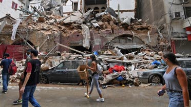Lebanese volunteers clear the rubble at the devastated Gemmayzeh neighbourhood, on August 7, 2020, in the aftermath of a massive blast which shook the capital Beirut. (AFP)