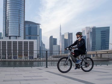 Sheikh Mohammed seen cycling with Burj Khalifa seen in the background. (Dubai Media Office)