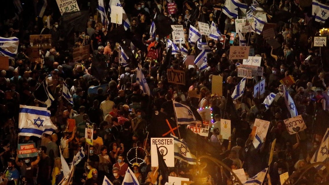 Thousands protest against Israel's Prime Minister Benjamin Netanyahu in front of his official residence in Jerusalem, on August 8, 2020. (AP)
