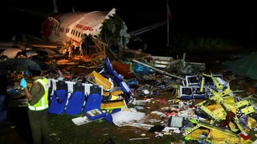 Wreckage from an Air India Express jet, which was carrying more than 190 passengers and crew from Dubai, after it crashed at Calicut International Airport in Karipur, Kerala, early on August 8, 2020. (AFP)