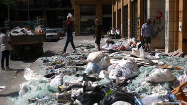 People clean debris from the street following Tuesday's blast in Beirut's port area, Lebanon August 8, 2020. (Reuters)