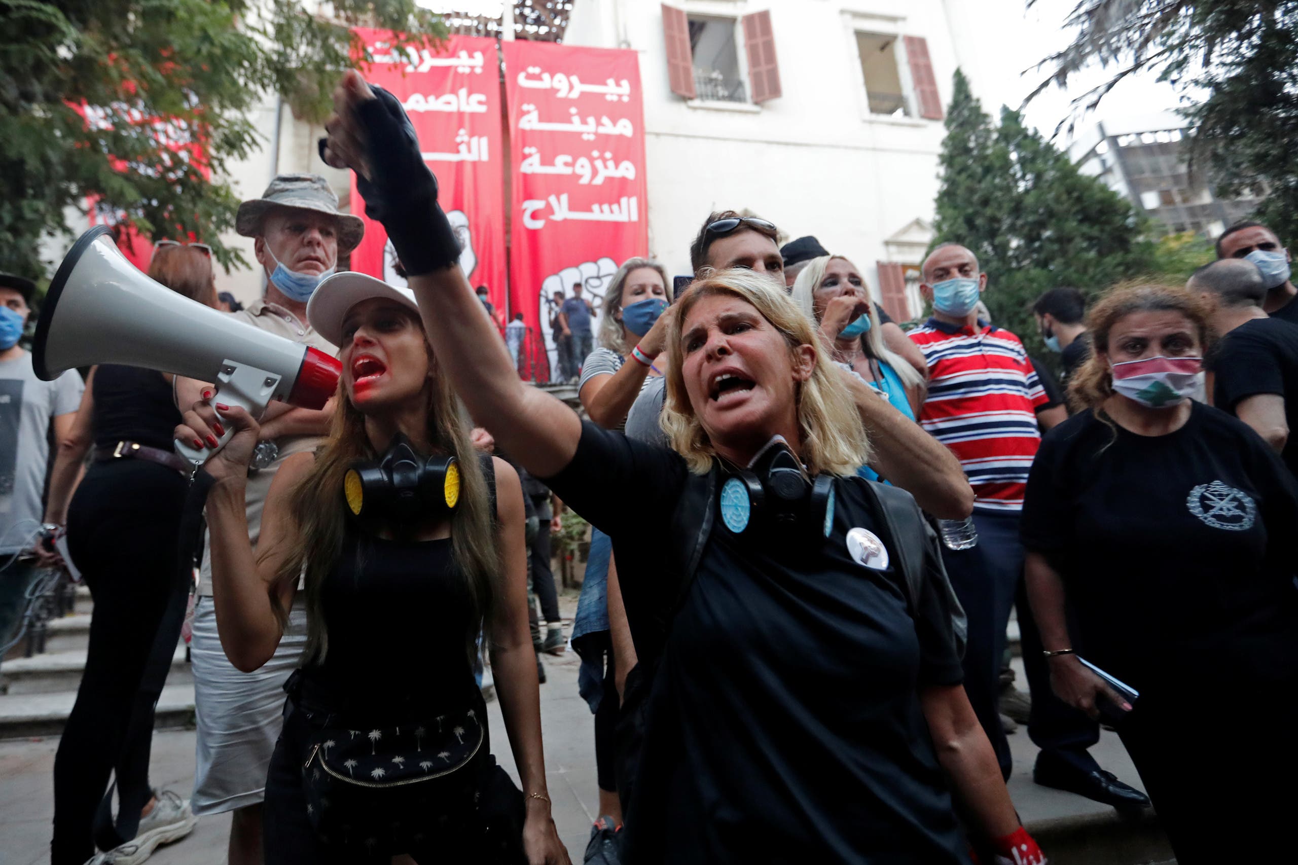 Demonstrators chant slogans outside the premises of the Lebanese foreign ministry during a protest following Tuesday's blast, in Beirut, Lebanon August 8, 2020. (Reuters)