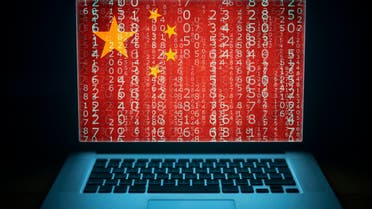 A Chinese hacker pictured with binary computer code and a China flag. (Stock Photo)