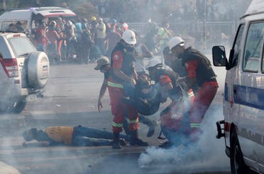 Rescuers assist demonstrators during a protest, following Tuesday's blast, in Beirut, Lebanon August 8, 2020.(Reuters)