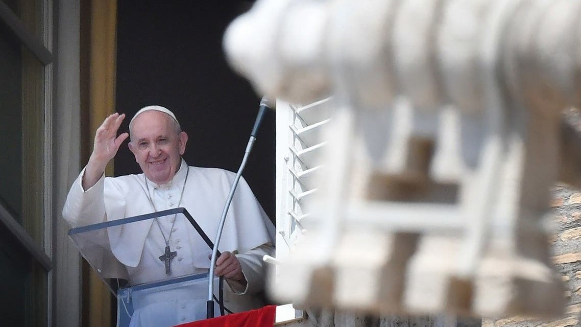 Pope Francis salutes from the window of the apostolic palace overlooking St Peter’s square during his Sunday Angelus prayer on August 9, 2020 at the Vatican. (AFP)