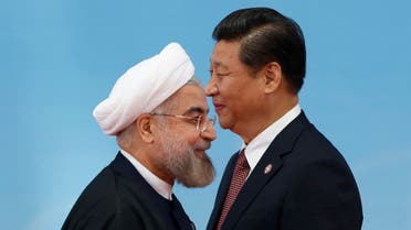 Iran's President Hassan Rouhani (L) shaking hands with Chinese President Xi Jinping in Shanghai May 21, 2014. (File photo: Reuters)