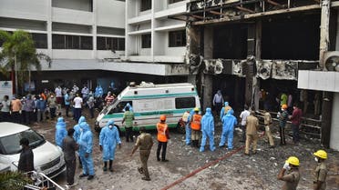 2020-08Rescue workers look for survivors after a fire broke out in a hotel that was being used as a coronavirus disease (COVID-19) facility in Vijayawada, in the southern state of Andhra Pradesh, India, on August 9, 2020. (Reuters)-09T045830Z_488982704_RC24AI9G6V3M_RTRMADP_3_HEALTH-CORONAVIRUS-INDIA-FIRE