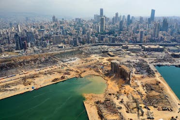 An aerial view taken on August 7, 2020, shows a partial view of the port of Beirut and the crater caused by the colossal explosion. (AFP)