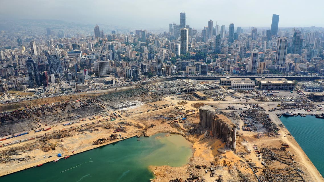 An aerial view taken on August 7, 2020, shows a partial view of the port of Beirut and the crater caused by the colossal explosion. (AFP)