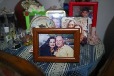 A photograph of the missing silo employee Ghassan Hasrouty pictured with his wife Ibtissam in the family home, following Tuesday's blast in Beirut's port area. (Reuters)