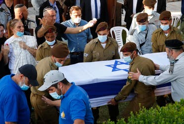 Family members and friends mourn during the funeral of Amit Ben Ygal, a 21-year-old Israeli army soldier who was killed in the village of Yaabed near the West Bank city of Jenin on May 12, 2020. (AFP)