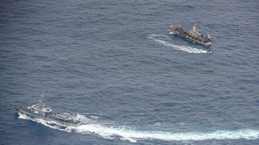 2020-Ecuadorian Navy vessels surround a fishing boat after detecting a fishing fleet of mostly Chinese-flagged ships in an international corridor that borders the Galapagos Islands’ exclusive economic zone, in the Pacific Ocean, August 7, 2020. (Reuters)08-09T144447Z_688092260_RC2EAI9QEFR7_RTRMADP_3_ECUADOR-ENVIRONMENT-CHINA