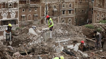 Workers demolish a rain damaged building in the UNESCO World Heritage site of the old city of Sanaa, Yemen August 9, 2020. (Reuters)
