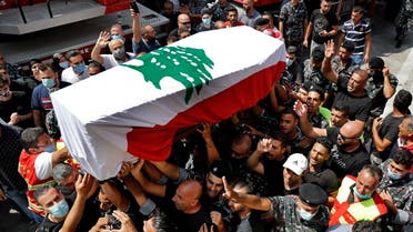 Firefighters carry the coffin of their comrade Rami Kaaki, one of ten firefighters who were killed during the explosion that hit the seaport of Beirut. (AP)