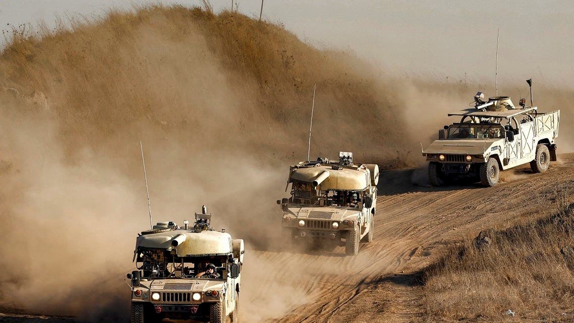 Israeli army training humvees equipped with mock cannon turrets drive during a military drill in the Israeli-annexed Golan Heights on August 4, 2020. (AFP)