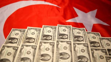 Dollar banknotes are placed on the Turkey flag in this picture illustration taken August 25, 2018. Picture taken August 25, 2018. REUTERS/Dado Ruvic/Illustration
