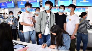 People attend a job fair for college graduates in Bozhou, Anhui province, China June 18, 2020. (China Daily via Reuters)