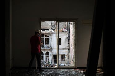 An engineer inspects a residential building heavily damaged in last week's explosion that hit the seaport of Beirut on Aug. 11, 2020. (AP)