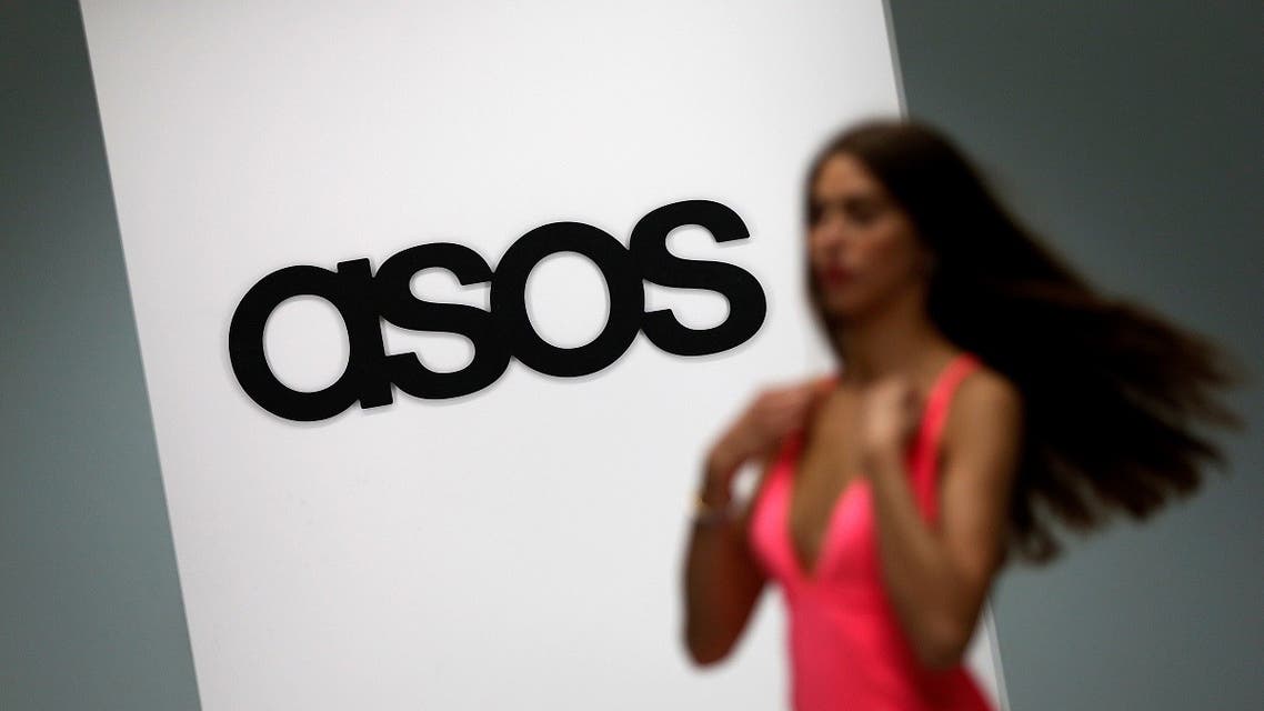 A model walks on an in-house catwalk at the ASOS headquarters in London April 1, 2014. (Reuters)