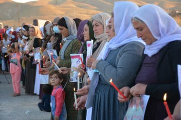 Yazidi women commemorate the ISIS attacks on their community. (Naji Khadida)