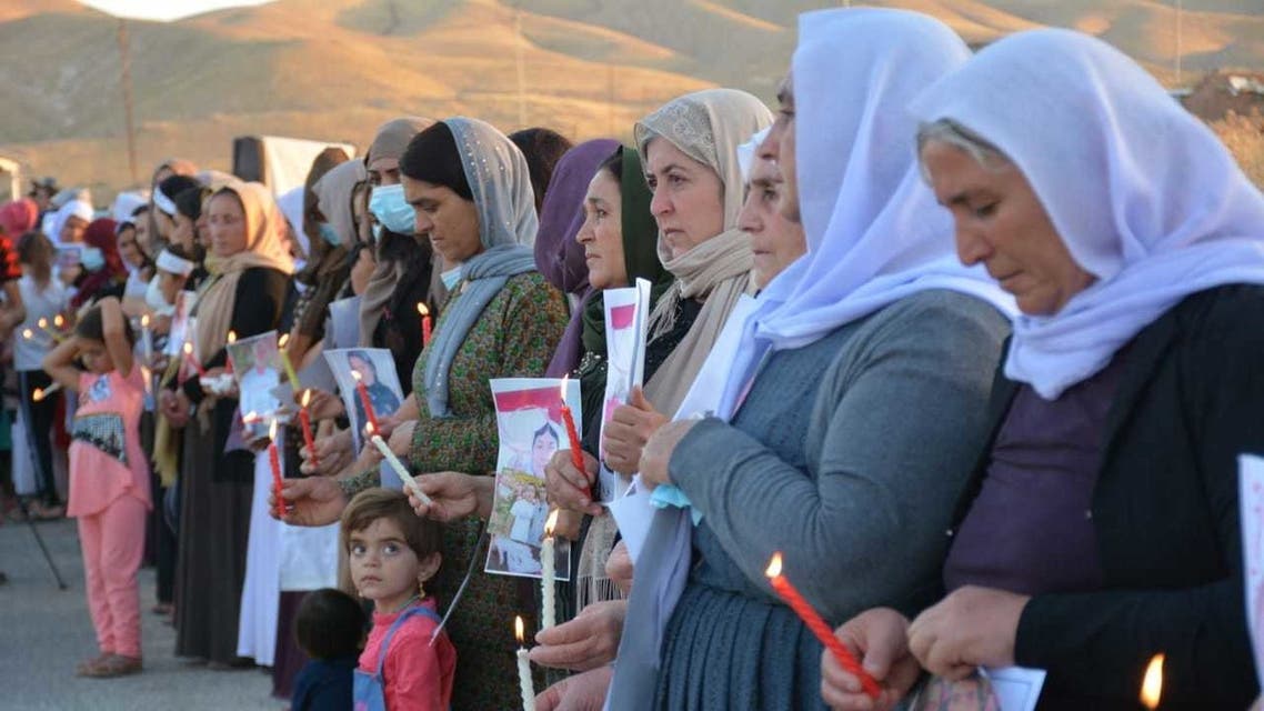 Yazidi women commemorate the ISIS attacks on their community. (Naji Khadida)