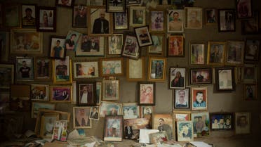In this Sept. 12, 2019 photo, pictures of Yazidis slain in 2014 by ISIS militants are found in a small room at the Lalish shrine in northern Iraq. (AP)
