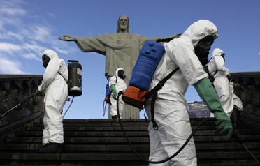 Military members work on disinfection of the Christ the Redeemer statue ahead of its re-opening in Rio de Janeiro, Brazil, August 13, 2020. (Reuters)
