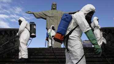 Military members work on disinfection of the Christ the Redeemer statue ahead of its re-opening amid the coronavirus disease (COVID-19) outbreak, in Rio de Janeiro, Brazil, August 13, 2020. REUTERS/Ricardo Moraes