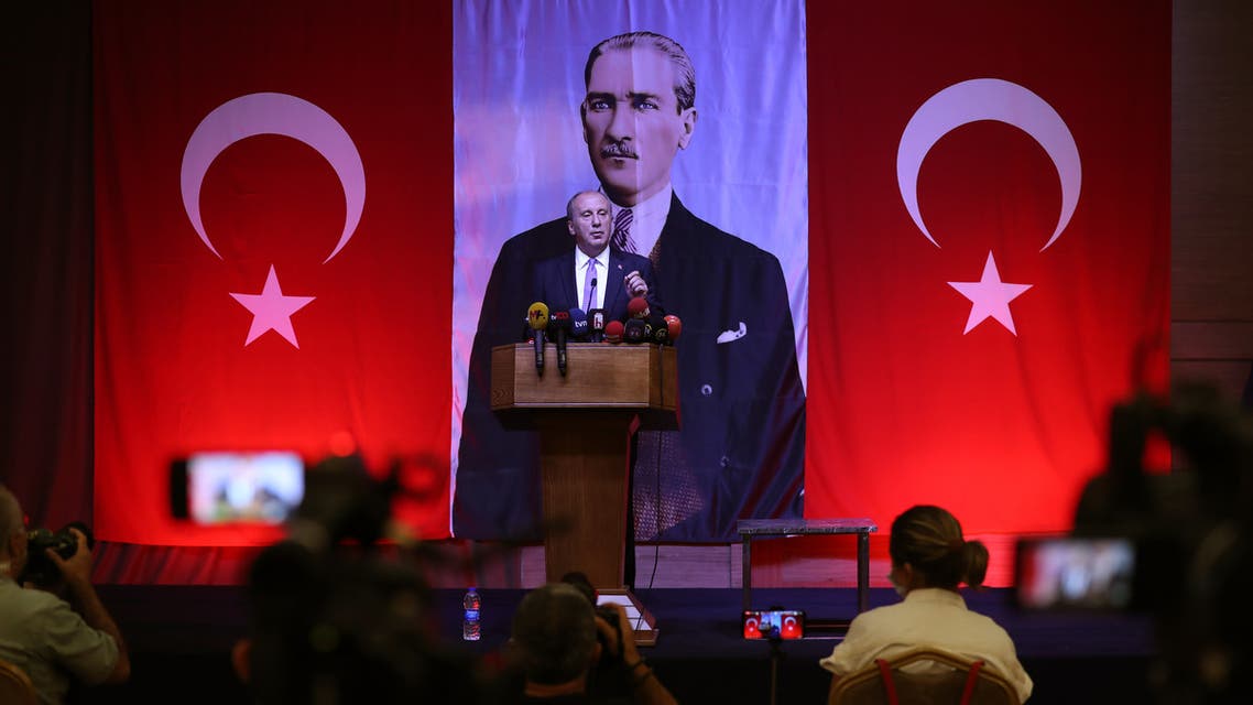Former presidential candidate Muharrem İnce of the Republican People's Party (CHP) addresses a press conference as he stands in front of an imgae of Kemal Ataturk, known as the 'Father of Turks' in Ankara on August 13, 2020. 