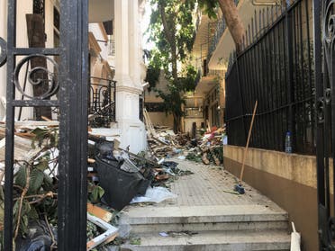 A view of the entrance to the building housing Art on 56th. Debris covers the walkway. (Maghie Ghali)