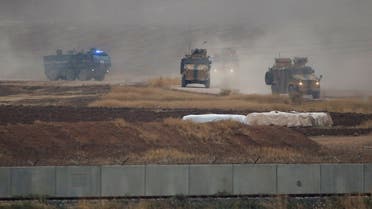 Turkish and Russian military vehicles return following a joint patrol in northeast Syria, as they are pictured from near the Turkish border town of Kiziltepe in Mardin province, Turkey, November 1, 2019. REUTERS