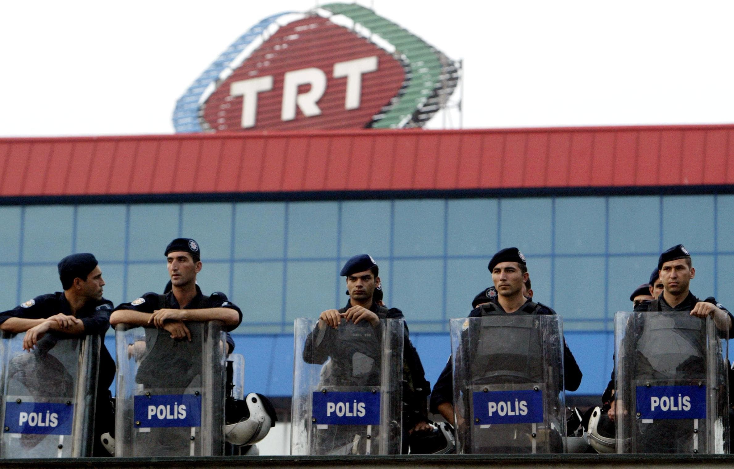 Turkish riot policemen stands guard as part of security measures in front of TRT (Turkish Radio Television Association) during a demonstration. (File photo: AFP)