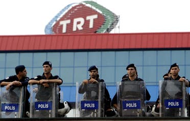 Turkish riot policemen stands guard as part of security measures in front of TRT (Turkish Radio Television Association) during a demonstration. (File photo: AFP)