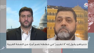 Osama Hamdan (right), the political Islamist group’s chief of International Relations, appears on Al Araby television channel. (Photo via Al Araby)