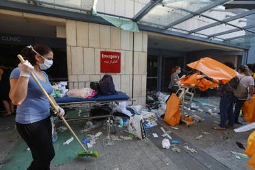 A woman sweeps at a damaged hospital following Tuesday's blast, in Beirut Lebanon August 5, 2020. (Reuters)