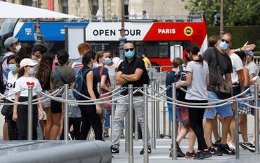 Visitors wearing protective face masks queue to enter the Louvre Pyramid in Paris, as France reinforces mask-wearing as part of efforts to curb a resurgence of the coronavirus disease (COVID-19) across the country, France, August 13, 2020. (Reuters)