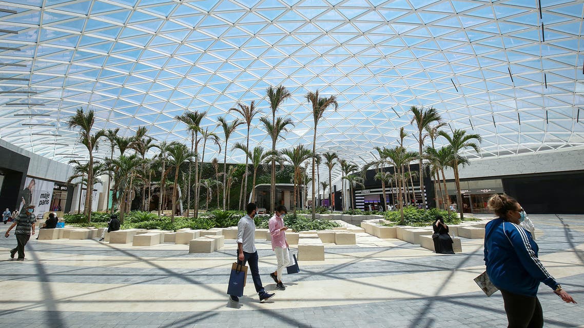 Kuwaitis wearing protective masks shop at the re-opened 360 Mall in the capital Kuwait City. (AFP)