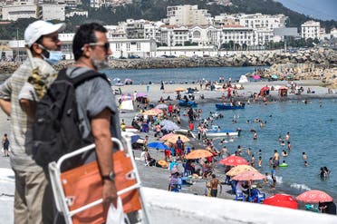 Beachgoers enjoy el-Kettani beach in the Bab el-Oued suburb of Algeria's capital Algiers after its reopening, August 15, 2020. (AFP)