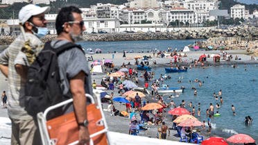 Beachgoers enjoy el-Kettani beach in the Bab el-Oued suburb of Algeria's capital Algiers after its reopening, August 15, 2020. (AFP)