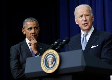 Former President Barack Obama listens as Vice President Joe Biden speaks in the South Court Auditorium in the Eisenhower Executive Office Building on the White House complex in Washington. (File photo: AP)