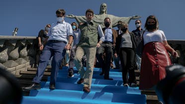 Brazilian Environment Minister Ricardo Salles (C) walks during the reopening day of touristic attractions, at the Christ The Redeemer statue, in the Corcovado Hill, Rio de Janeiro, Brazil, on August 15, 2020, amid the COVID-19 novel coronavirus pandemic. (AFP)