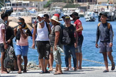 وصول مهاجرين من تونس إلى جزيرة لاميدوزا في أغسطس الماضي