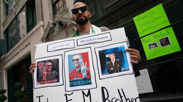 Chekib Drareni, brother of jailed Algerian journalist Khaled Drareni, protests for his brother's release outside the Algerian Consulate on August 15, 2020 in New York. (AFP)