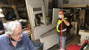 Toni Shadarevian supervises maintenance workers fixing the workshop of painter Krikor Zohrab. (Sip cafe, located in a trendy Beirut neighborhood, was badly damaged in the August 4 explosion at port in Lebanon's capital. (Bassam Zaazaa)