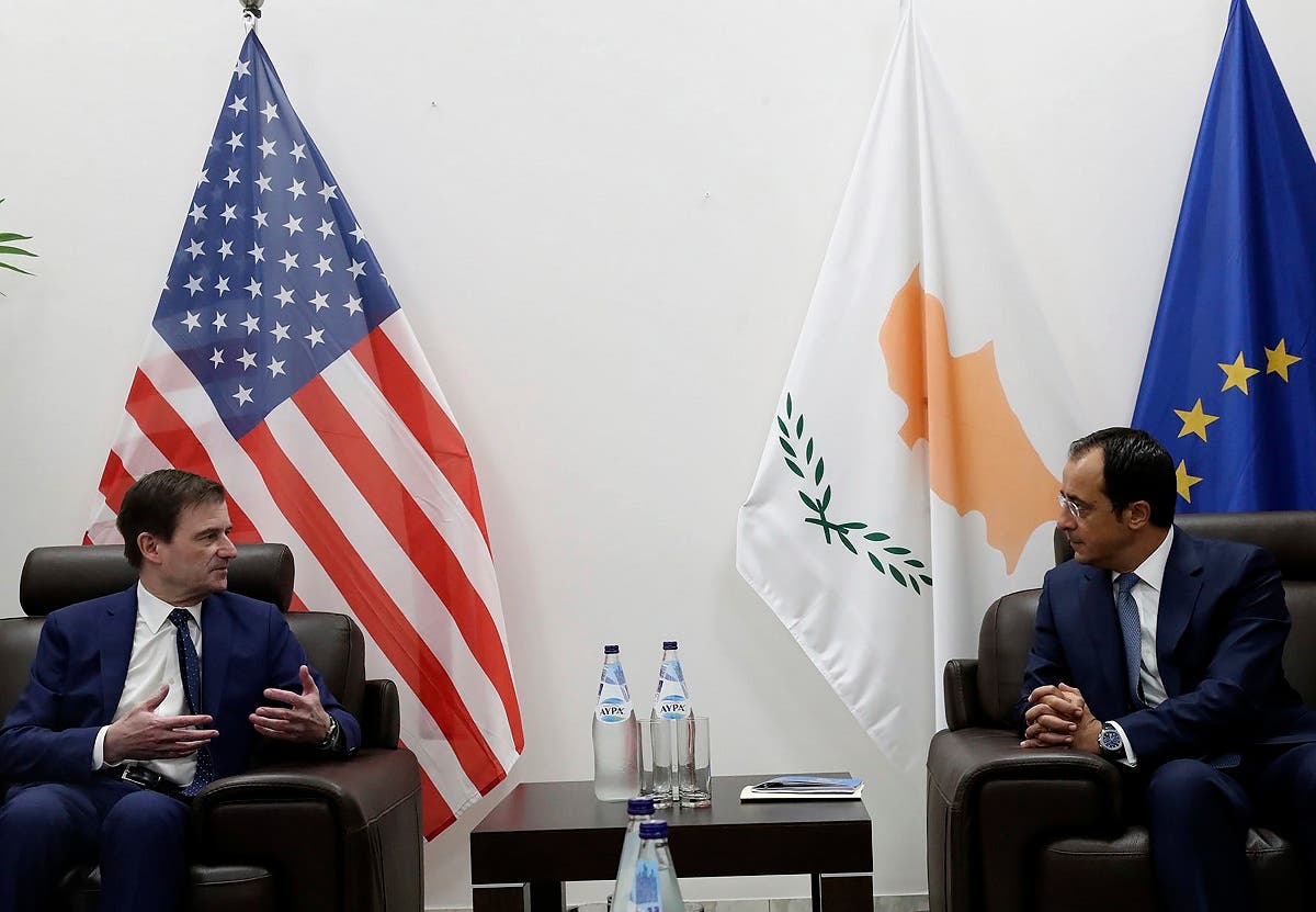 Cyprus' foreign minister Nikos Christodoulides, right, talks with Under Secretary of the United States of America, for Political Affairs, David Hale during their meeting at Larnaca international airport, Cyprus, Sunday, Aug. 16, 2020. (AP)